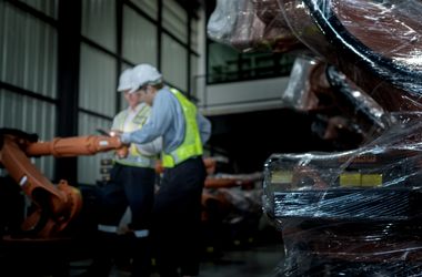 team engineers inspecting on machine with smart tablet. worker w